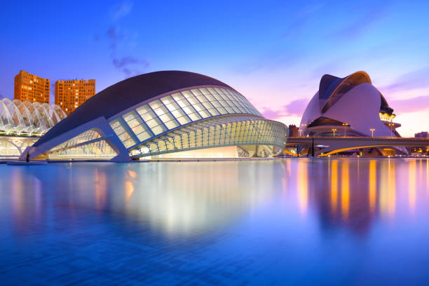 Valencia, Spain - July 31, 2016: The city of the Arts and Sciences and his reflection in the water at dusk. This complex of modern buildings was designed by the architect Santiago Calatrava